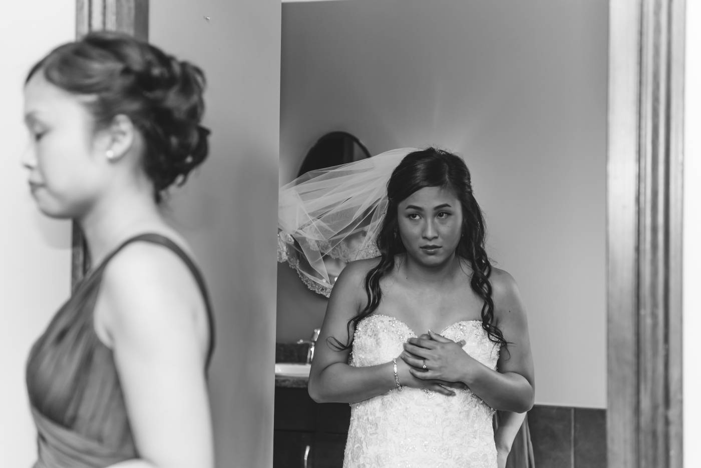 Bride getting on dress